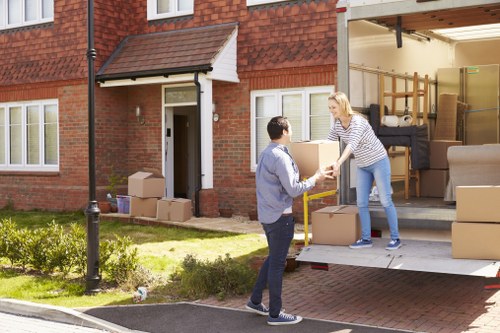Removal team planning a safe home move with protective packing materials