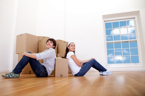 Moving crew handling furniture during a property removal