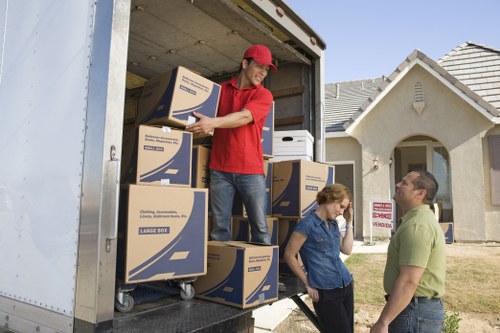 Professional movers preparing items for transport in North London