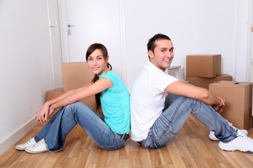 Furniture being carried through a flat staircase in Finchley