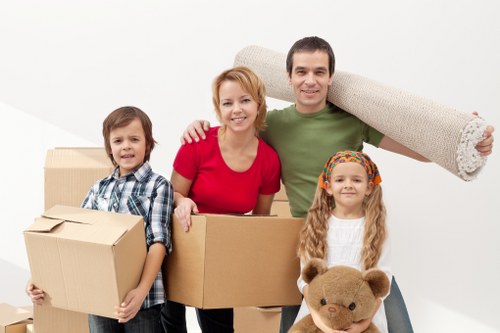 Local moving van handling household boxes and furniture in Finchley