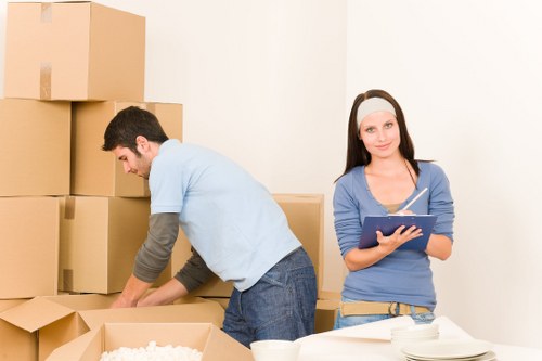 Professional movers handling fragile items during a Finchley move