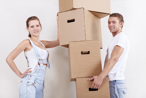 Covered moving boxes and furniture loaded carefully into a removal vehicle