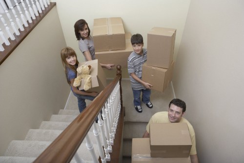 Professional movers handling furniture in Finchley